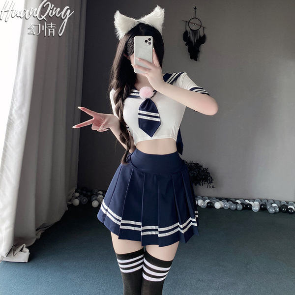 A person wearing a japanese-korean school uniform set, featuring a cute sailor collar, bunny ears, and a pleated skirt, posin...