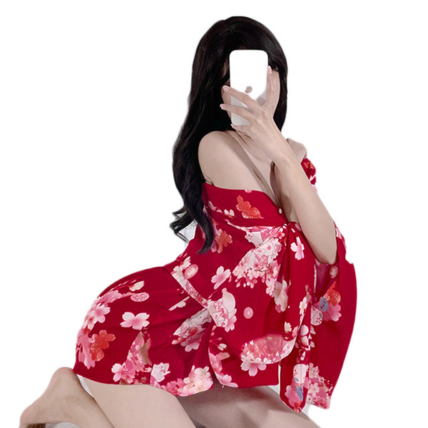 A woman poses with a smartphone, wearing a vibrant red japanese-style lace kimono lingerie set. the dress features floral pat...