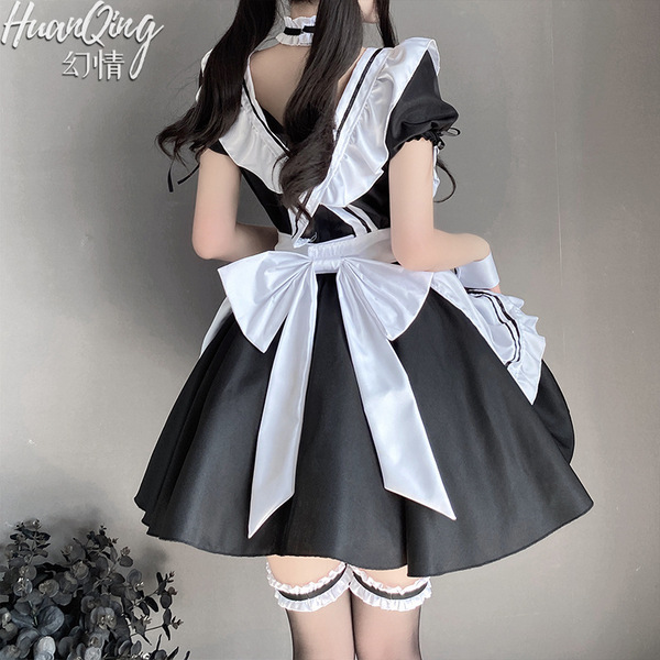 Japanese lolita maid costume set featuring a black lace bodice with white accents, paired with thigh-high stockings for a cla...