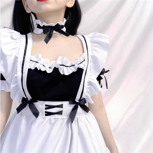 Japanese maid cosplay dress featuring black and white design with ruffles, bows, and corset detail, perfect for anime school ...