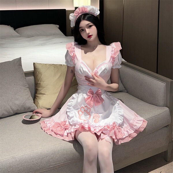 A woman wearing a japanese maid cosplay dress featuring a sweet cat girl design, with a ruffled skirt and cute soft style.