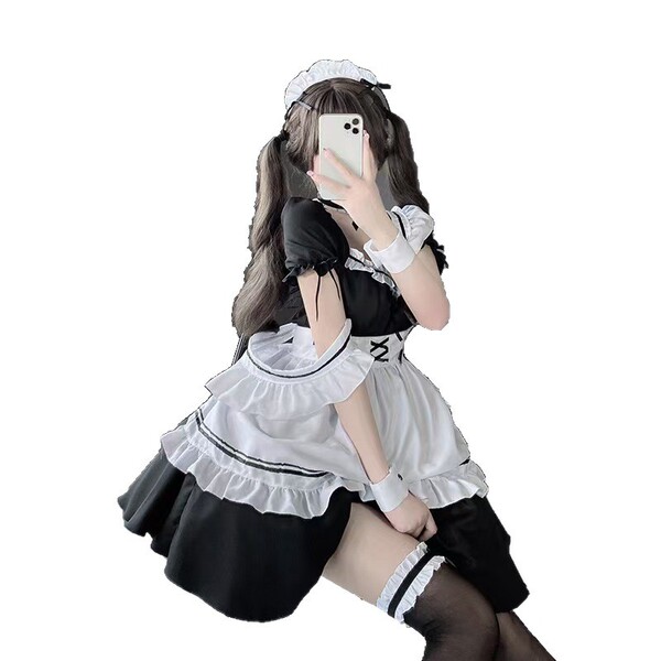Japanese maid costume with cute lolita design, perfect for cosplay or themed events. includes ruffled apron and stockings.