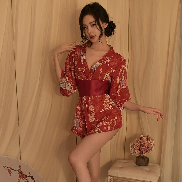 A woman poses elegantly in a japanese-style sexy lingerie set featuring a deep v neckline and floral print, paired with a mat...