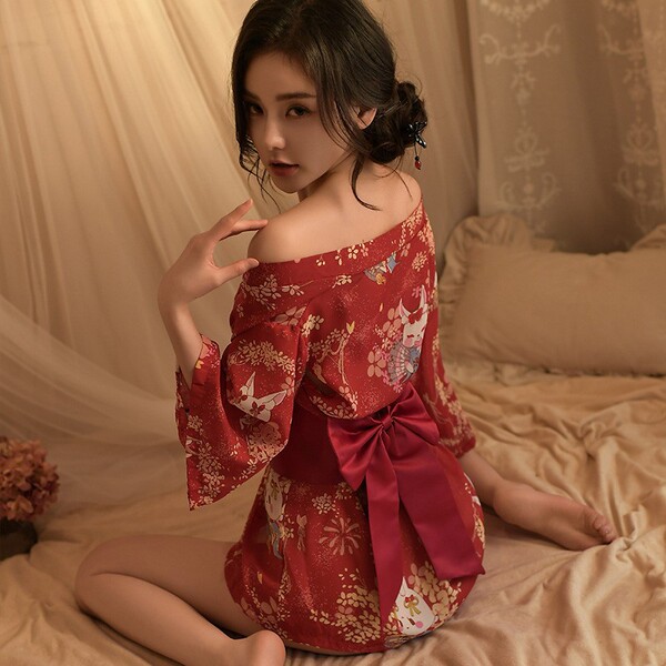 A woman poses elegantly wearing a japanese-style sexy lingerie set, featuring a deep v neckline and floral print. the outfit ...
