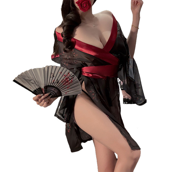 A woman poses elegantly in a black japanese-style kimono sleepwear set, featuring red accents and floral patterns. the outfit...