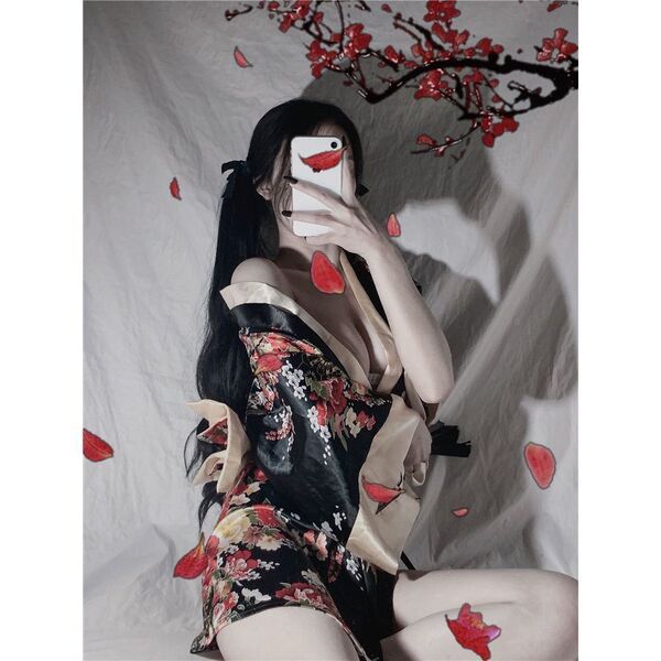 A woman poses with a smartphone, wearing a japanese-style sexy sleepwear set featuring a kimono-inspired nightgown and robe w...