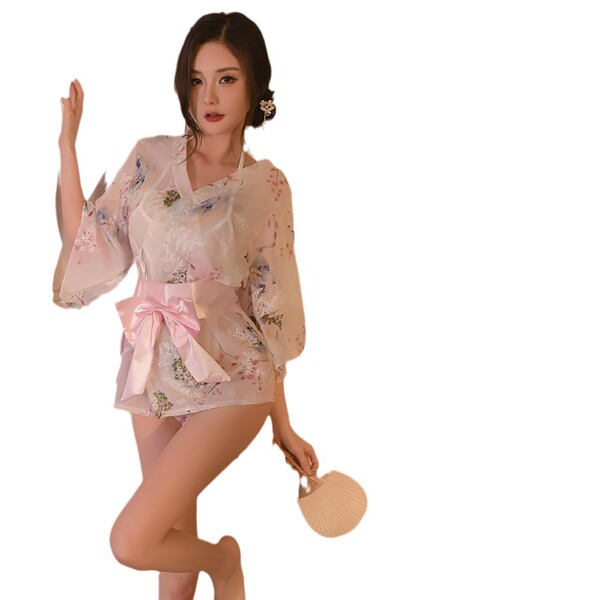 A woman poses wearing a japanese-style sheer lace bathrobe set featuring sweet sakura floral patterns, a prominent pink bow d...
