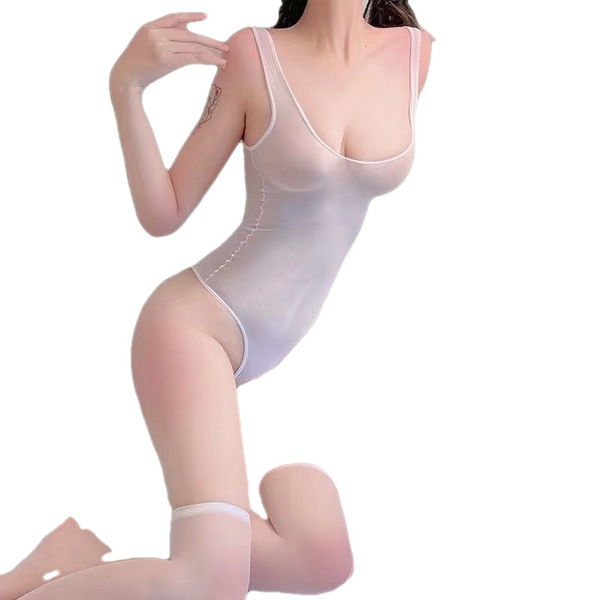 A woman poses wearing a sheer lace bodysuit with a push-up effect, featuring an open-crotch design inspired by swimwear and s...