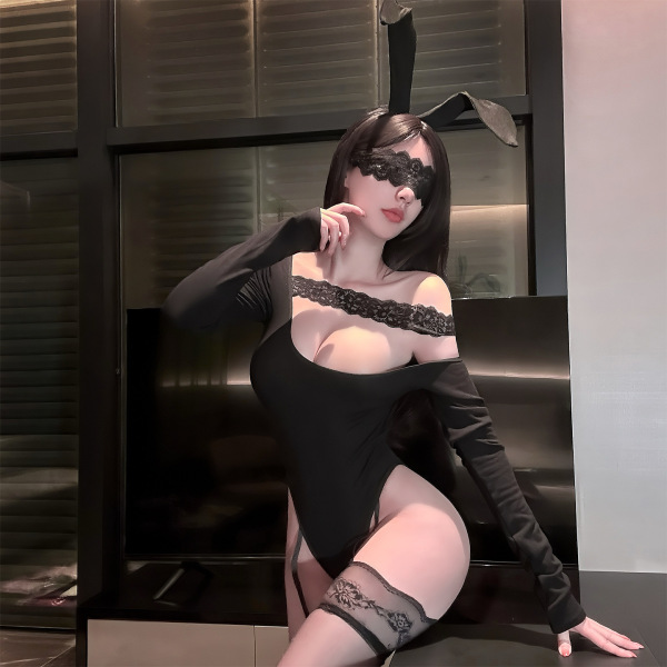 Woman wearing jinxiao alluring lace bodysuit with sheer off-shoulder design, lace trim, and bunny ears for sensual allure.