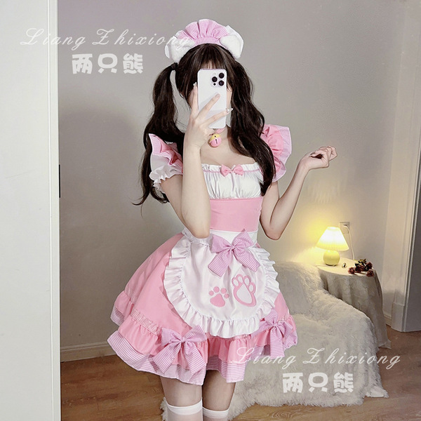A woman wearing a cute pink maid dress with ruffles and bows, perfect for cosplay or anime-themed outfits.