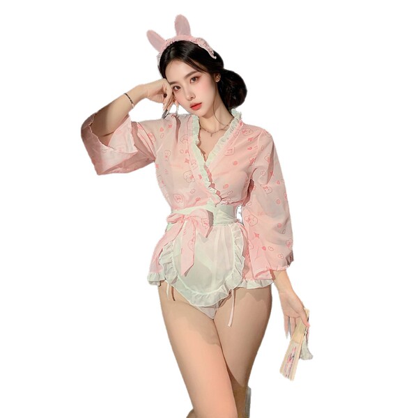 A woman models a pink kimono-style lingerie set featuring bunny ears, perfect for couples intimate wear with a touch of elega...