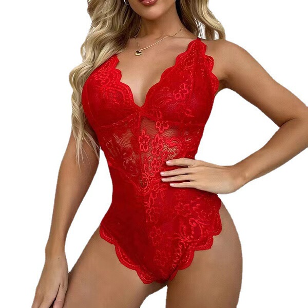 Woman modeling a red lace bodysuit with sheer mesh panels and scalloped edges, designed as sexy plus size erotic lingerie.
