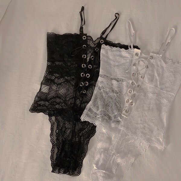 Black and white lace cami bodysuits with bind-up front detail, perfect for spring and summer.