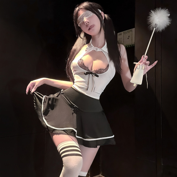 Woman modeling lace jk style sensual lingerie set with bow detail - busty sheer peek-a-boo maid outfit, holding feather wand.