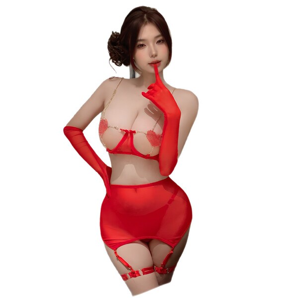 Woman wearing red lace love chain lingerie set with sheer mesh, long gloves, and garter straps.