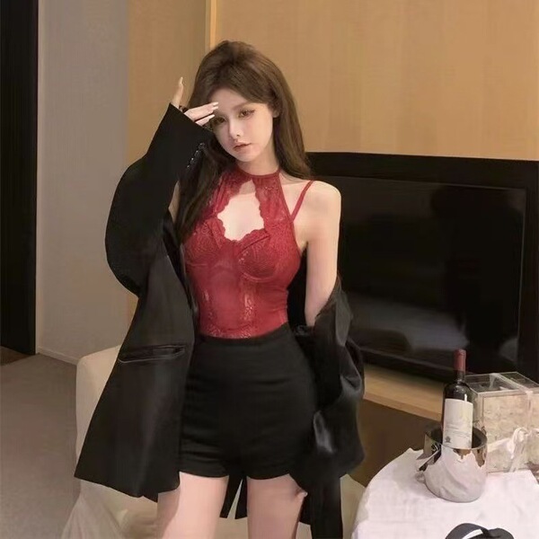 Woman wearing red lace mesh sheer bodysuit with cut-outs and ties, styled as streetwear-inspired sexy lingerie set.