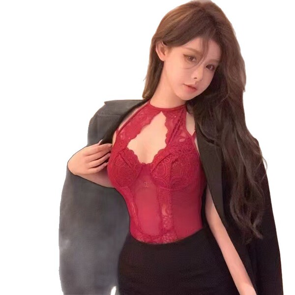 Woman wearing red lace mesh sheer bodysuit with cut-outs and ties, styled under a black blazer for streetwear-inspired sexy l...