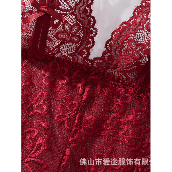 Close-up of red lace cami set with floral patterns and bow detail, elegant erotic bodysuit for women.