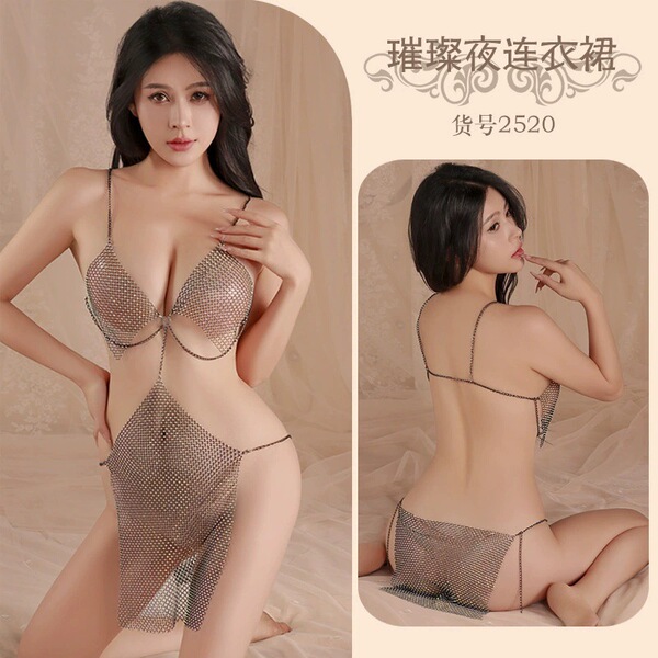 Woman modeling a sheer mesh bodysuit dress with cut-outs, featuring delicate straps and a seductive design for nightlife or l...