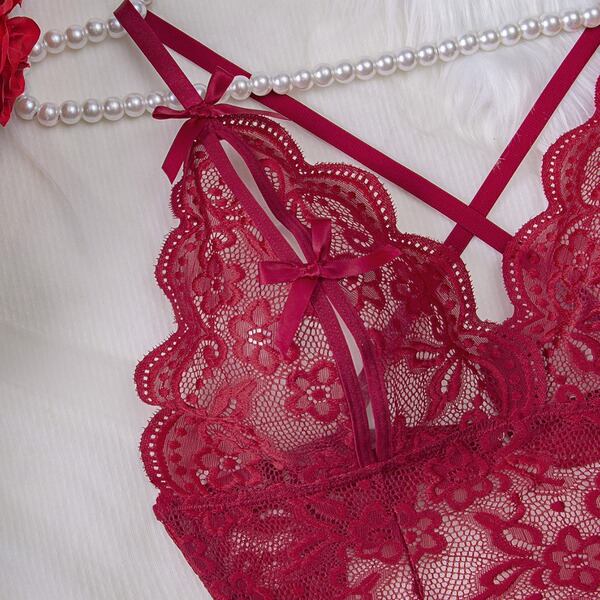 Lace sheer bodysuit featuring intricate floral patterns, elegant red ribbon accents, and pearl embellishments for a sexy euro...