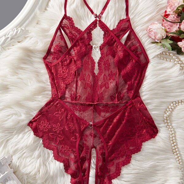 Sexy lace sheer bodysuit for women, featuring european style design with intricate floral patterns and full-body transparency...