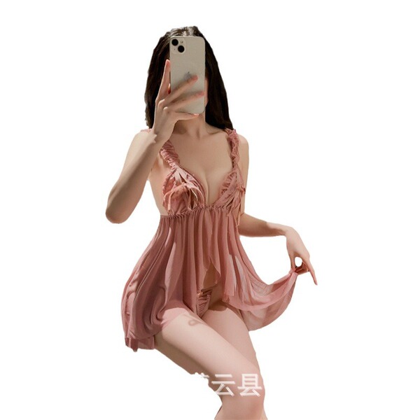 Woman in pink lace sleepwear taking mirror selfie, sheer satin slip dress with push-up support and elegant details.