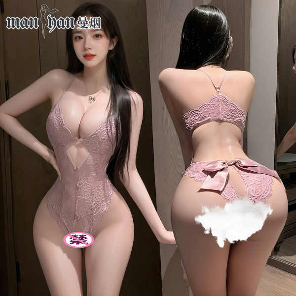 Woman modeling pink lace open-crotch bodysuit, sheer sexy sleepwear with bow back detail.