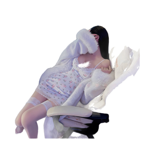 Woman in lace trim lingerie sleep set with sheer slip dress and tight-fit seductive nightwear, lounging on a chair.