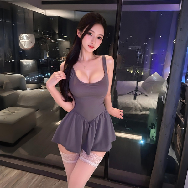 A stylish woman poses in a chic gray bodysuit from lemon story, perfect for date nights, car rides, or sleepwear. the no-remo...