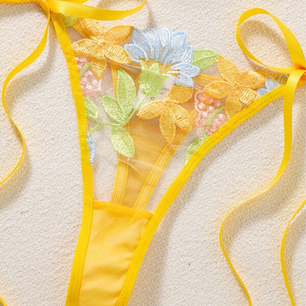 Yellow lace thong with floral embroidery and side ties from lightweight sexy lingerie set.