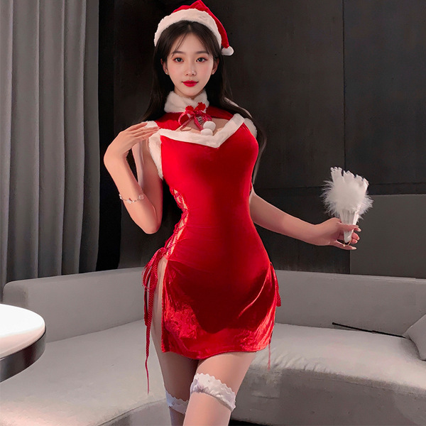 A woman wearing a festive red velvet dress with santa hat, holding a feather accessory, perfect for holiday role play and cos...