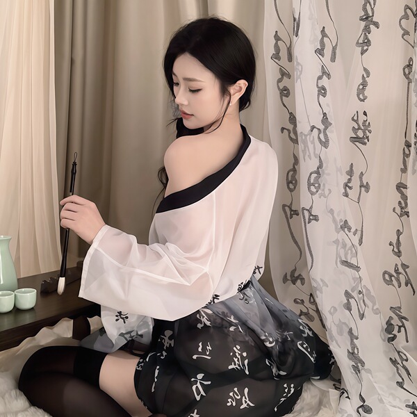 A woman wears a delicate lobei sexy japanese-style kimono sleepwear set featuring a chiffon robe with bow-tie details and mat...