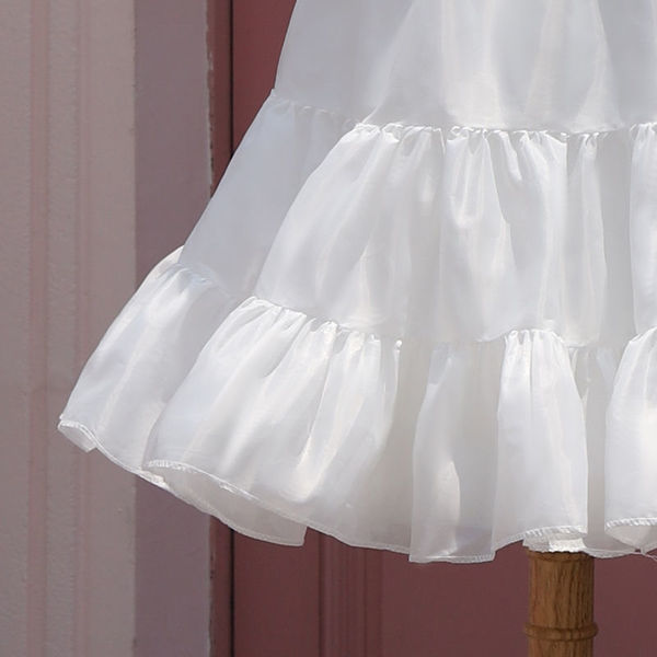White sheer tulle petticoat with multiple layers, soft and adjustable design, perfect for lolita style dresses.