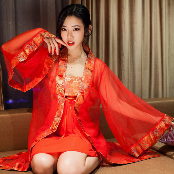 Woman wearing red lace sheer bridal lingerie set with satin goddess robe and long sleeves for romantic nights.