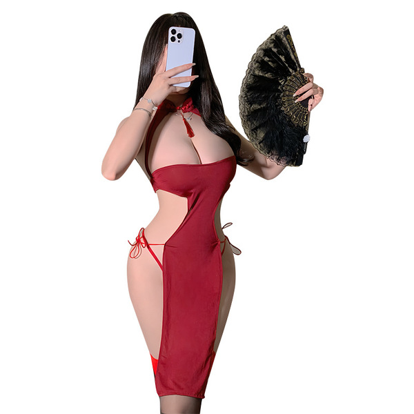 A woman poses in a red night mystique lace cut-out cheongsam sleepwear set, featuring a sexy high-slit long dress with ties a...