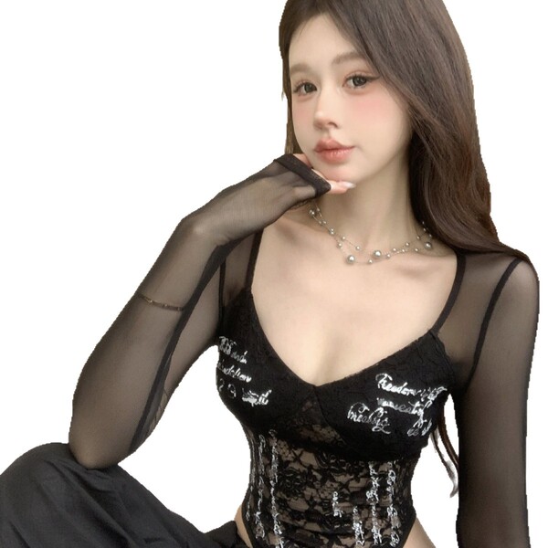 Woman wearing black lace bodysuit with sheer long sleeves and silver script details, elegant and seductive design.