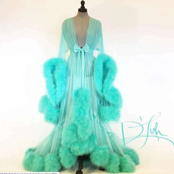 Sexy feather sheer nightgown featuring long sleeves, lace trim, flared design, and voluminous train.