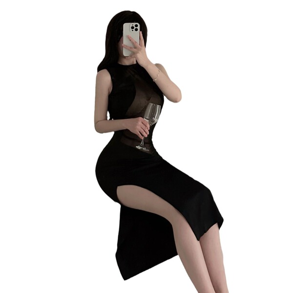 Woman in black sheer bodycon dress with lace mesh, holding wine glass — sexy nightclub party look.