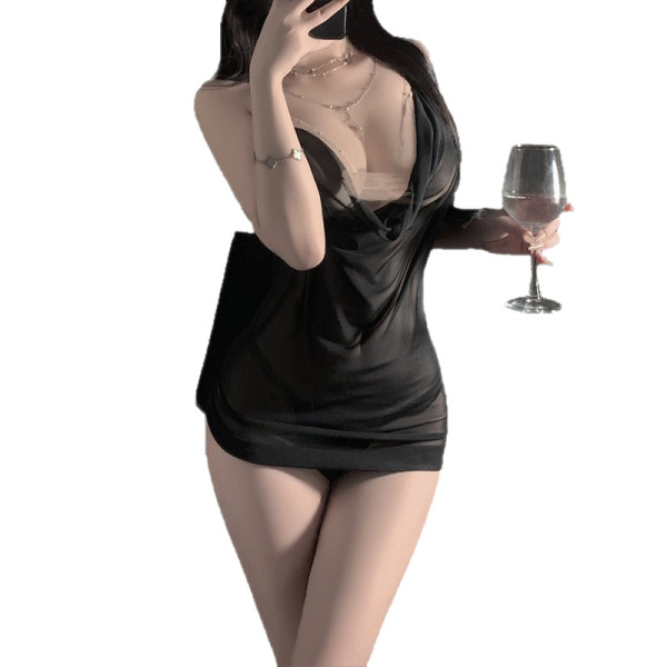 Woman in black sheer mesh halter sleep dress with deep v-neck, holding wine glass and phone. luminous gold lace bodysuit styl...