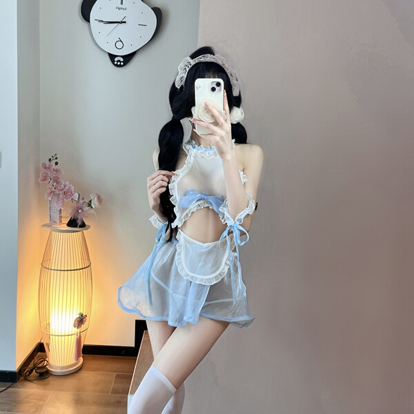 Woman wearing machu chu maid costume set - cute sheer blue and white lingerie with apron, headpiece, and thigh highs.