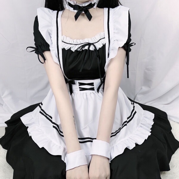 Cute maid cosplay dress featuring black and white colors with ruffles and bows, perfect for lolita style outfits.