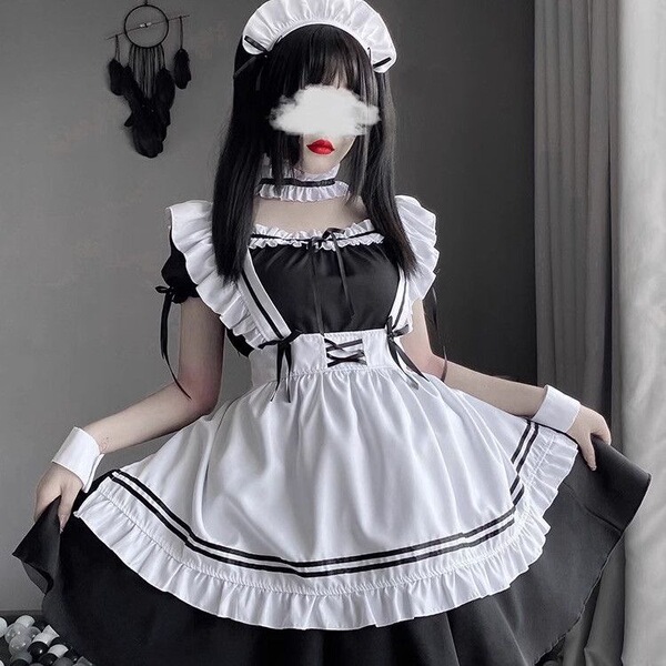 A woman wearing a maid costume cosplay dress, featuring a black and white design with ruffles and a bow headband. perfect for...