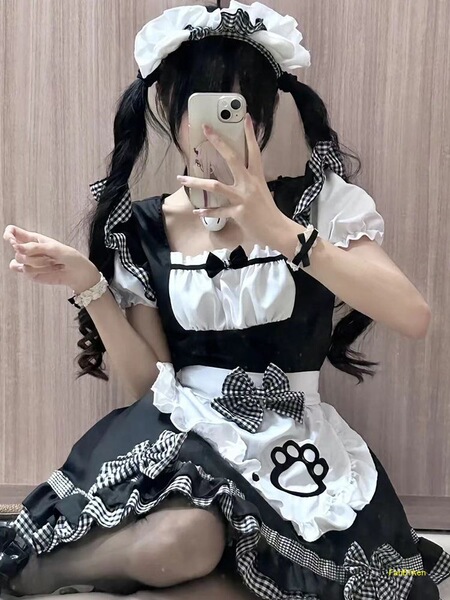 A cute maid costume cosplay dress featuring black and white checkered patterns, fluffy ruffles, and adorable cat ear accents,...