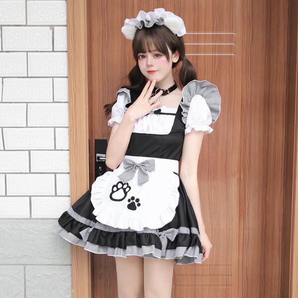 A woman wearing a black and white maid costume cosplay dress, featuring paws on the apron, perfect for anime cat girl lolita ...