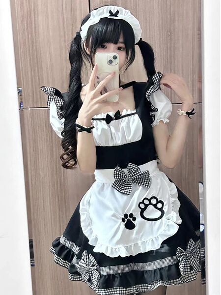 A cute maid costume cosplay dress featuring black and white colors, charming cat ears, and soft lolita design perfect for ani...