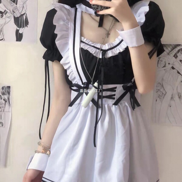 A woman wearing a black and white maid costume cosplay outfit, featuring ruffled sleeves and a sailor-style design, perfect f...