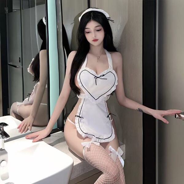 A woman poses in a maid-themed lingerie set featuring sheer fabric and heart accents, perfect for cosplay or playful date nig...