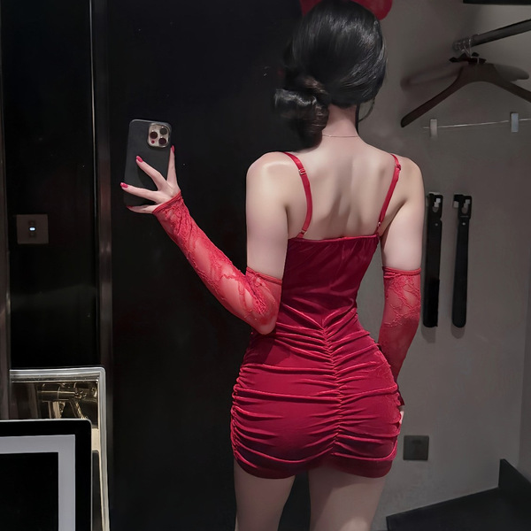 Red lace-up bodycon dress with ruched design, perfect for evening elegance and allure.