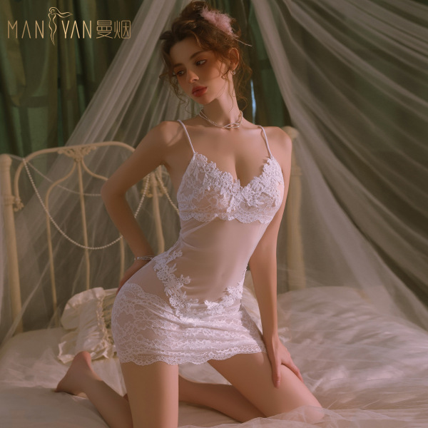 Woman wearing white mannyan french-style lace chemise, sheer sexy sleep dress with delicate embroidery and bodycon fit.