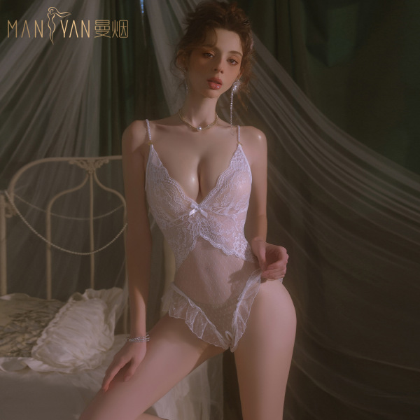 Woman modeling mannyan sexy lingerie set - white beaded lace polka dot bodysuit with open-crotch design and ruffled trim.
